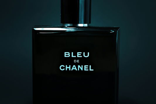 A black bottle with the words bleu de chanel on it